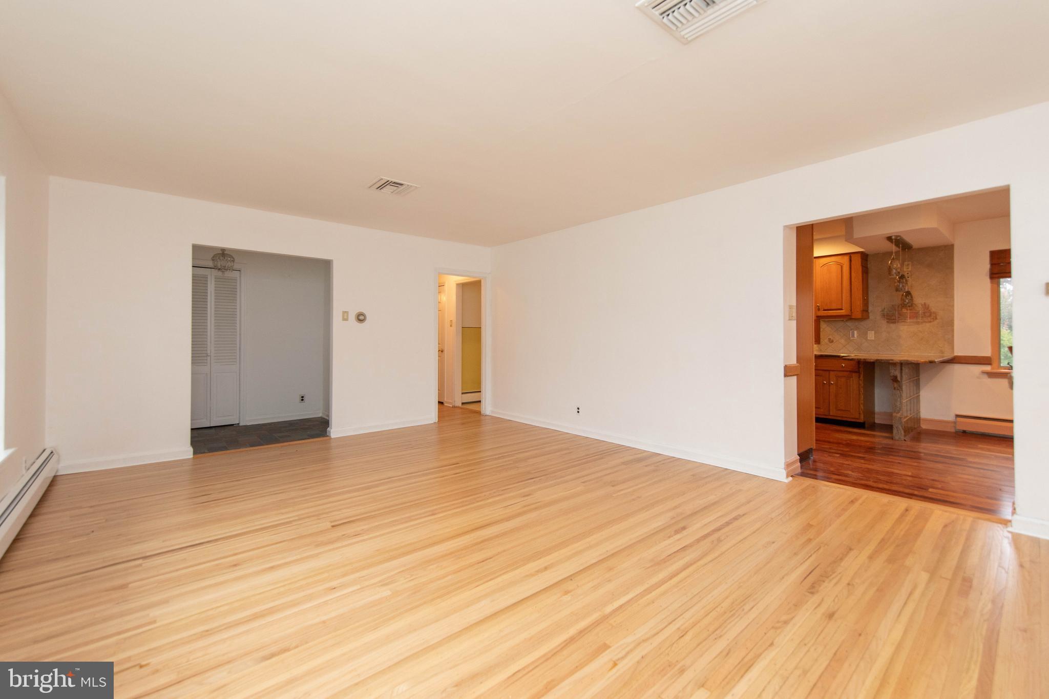 95 Radburn Road Huntingdon Valley, PA 19006 - Photo 15 of 40 a view of empty room with wooden floor and fan