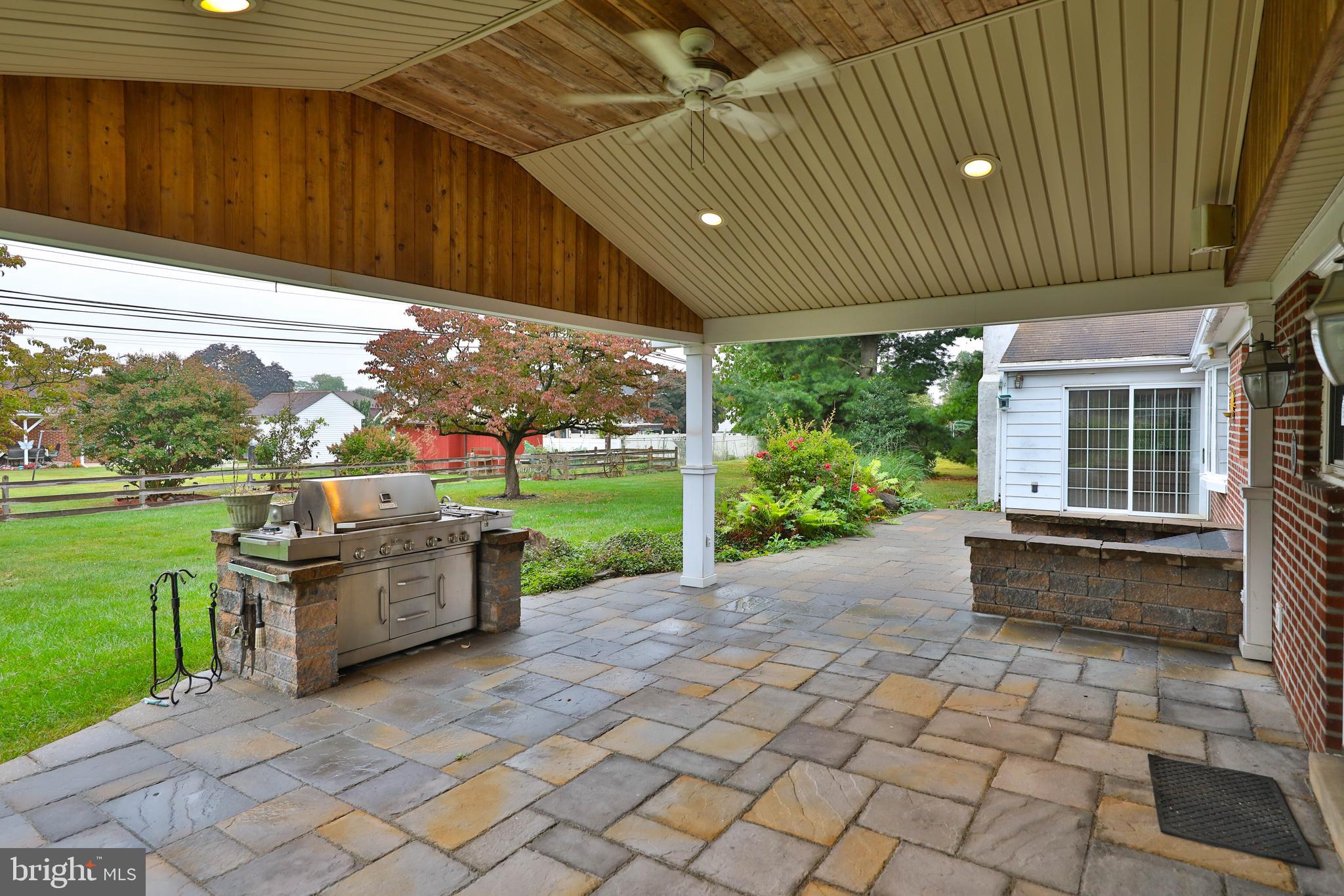 95 Radburn Road Huntingdon Valley, PA 19006 - Photo 2 of 40 a patio with glass windows and garden