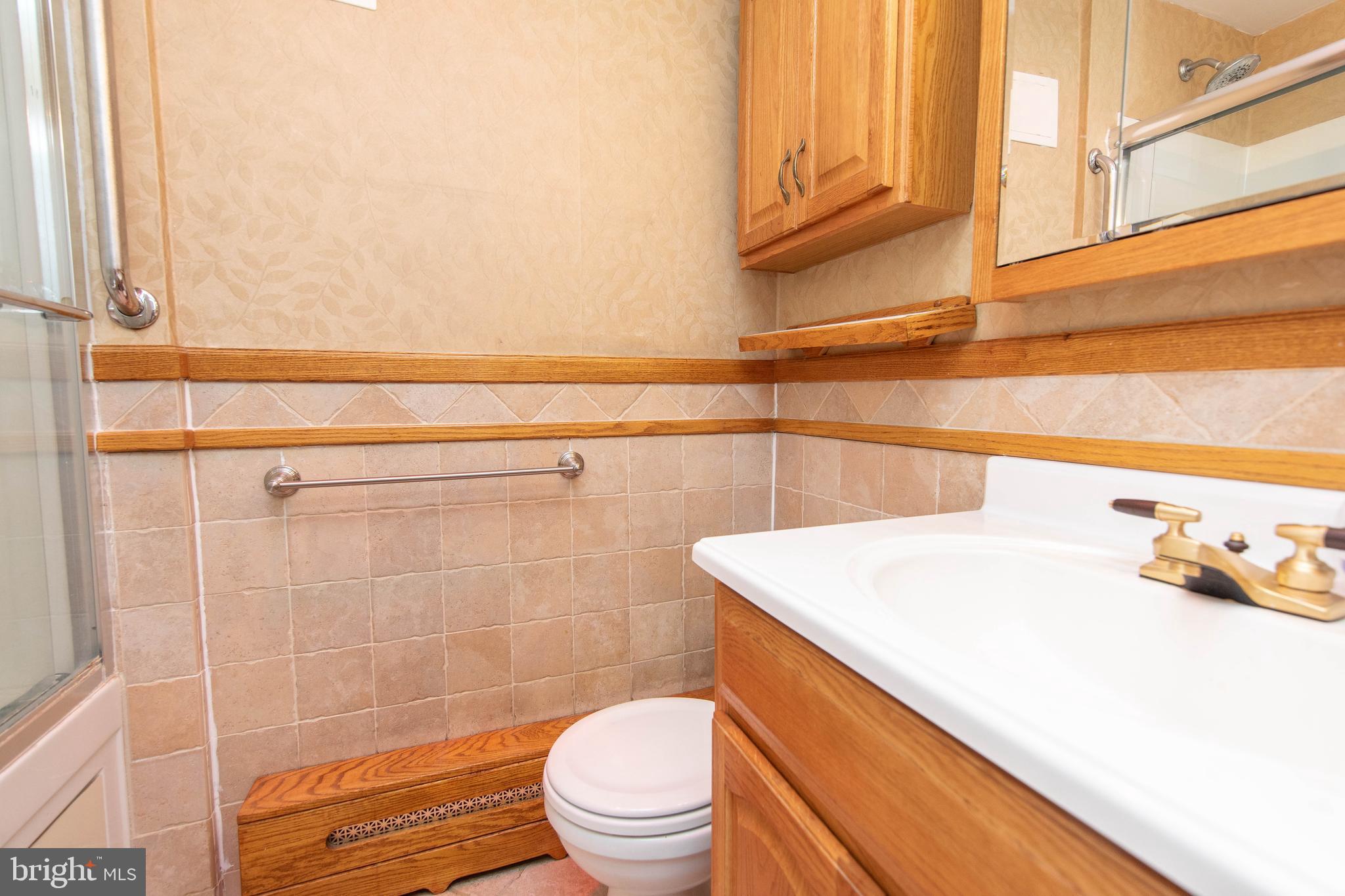 95 Radburn Road Huntingdon Valley, PA 19006 - Photo 21 of 40 a bathroom with a sink a toilet and shower