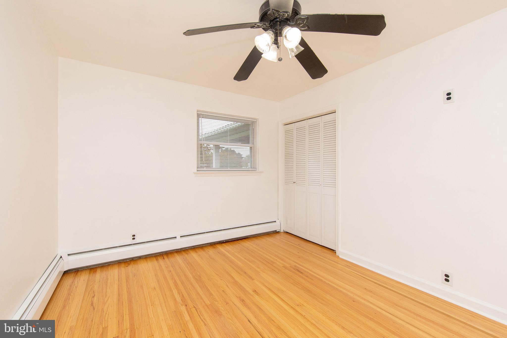 95 Radburn Road Huntingdon Valley, PA 19006 - Photo 22 of 40 a view of a room with a window and wooden floor