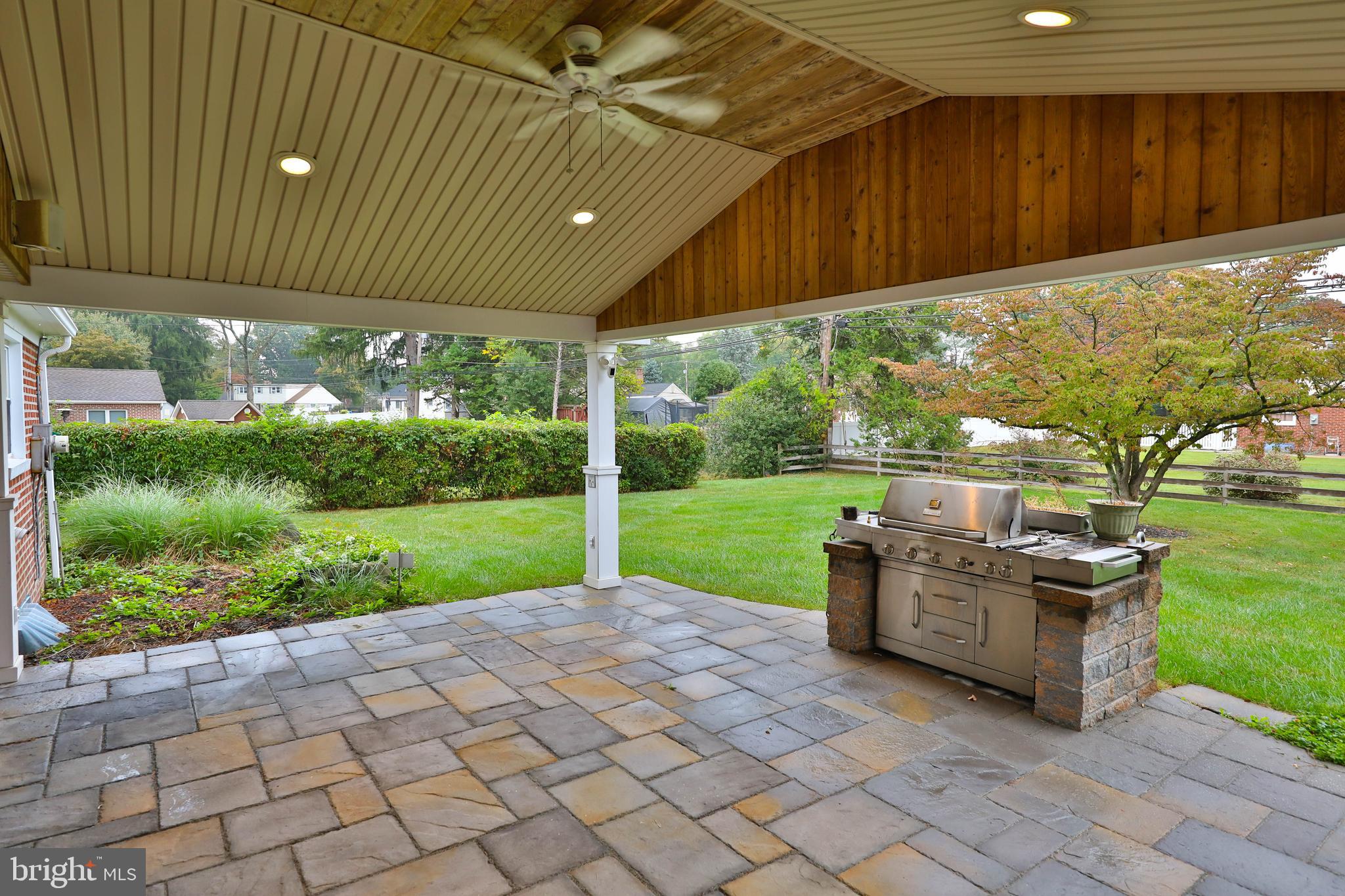 95 Radburn Road Huntingdon Valley, PA 19006 - Photo 34 of 40 a patio with a yard table and chairs