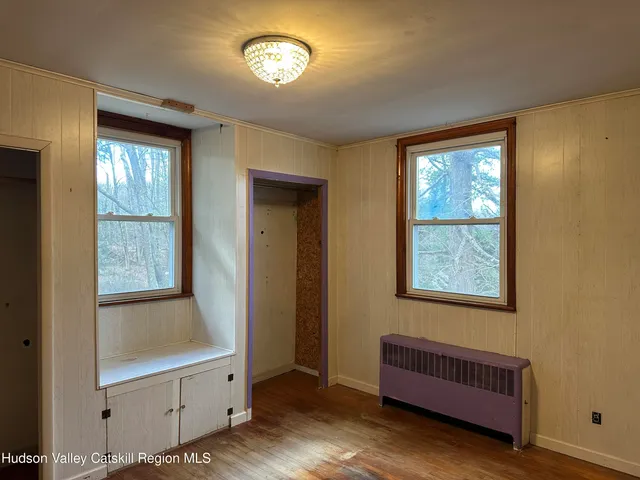 a view of room with furniture and windows