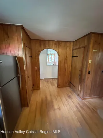 a view of entryway with wooden floor
