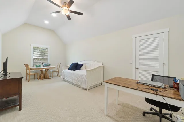 a view of a house with backyard sitting area and garden