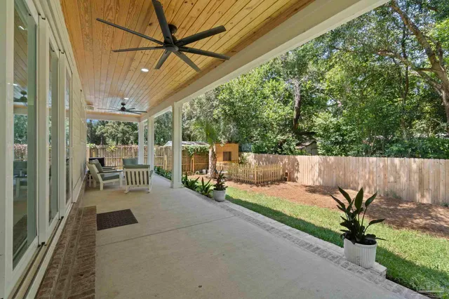 a view of outdoor space with deck and yard
