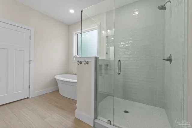 a bathroom with a shower a toilet and sink