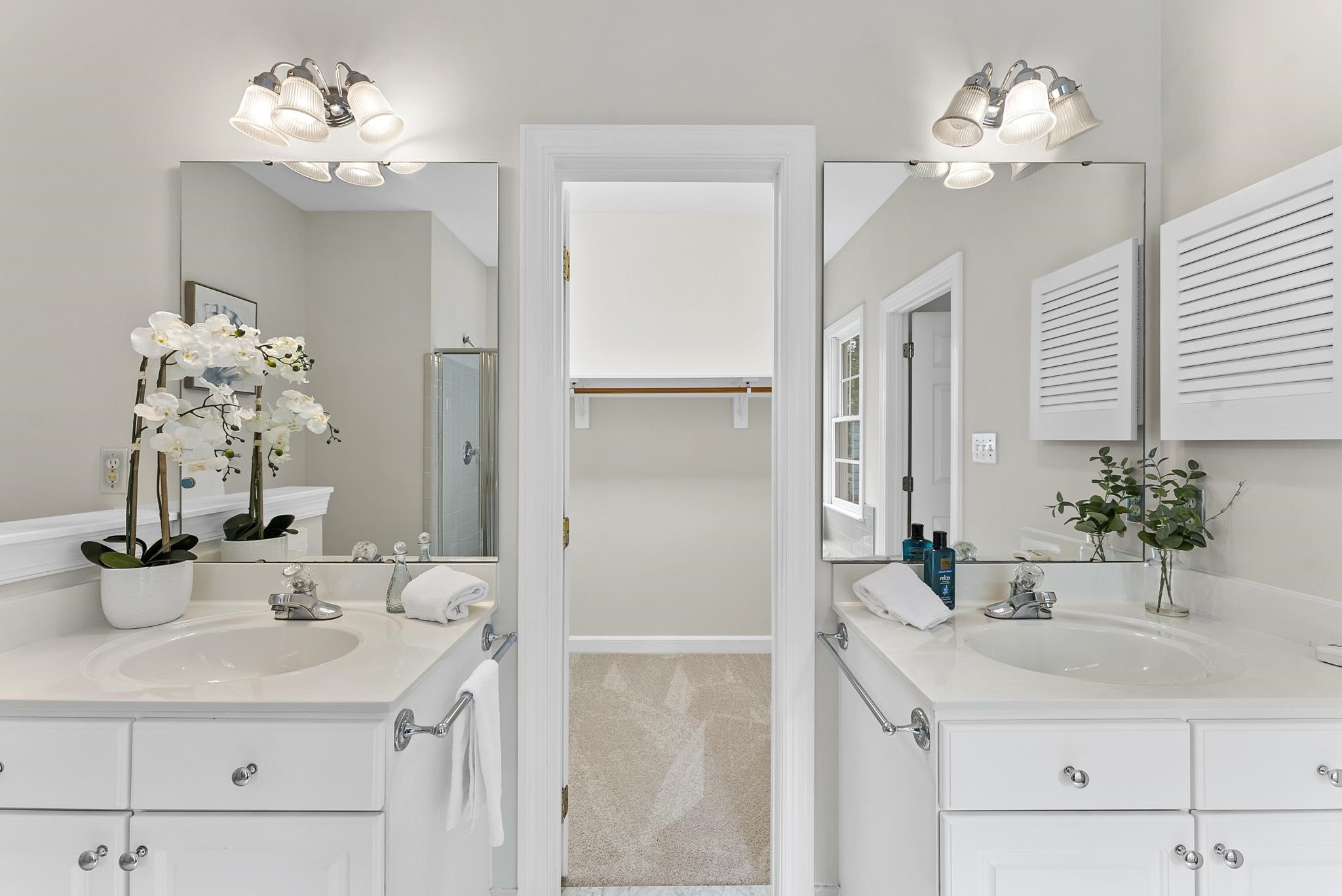 1608 Falls River Avenue Raleigh, NC 27614 - Photo 22 of 65 a bathroom with a sink vanity and a mirror