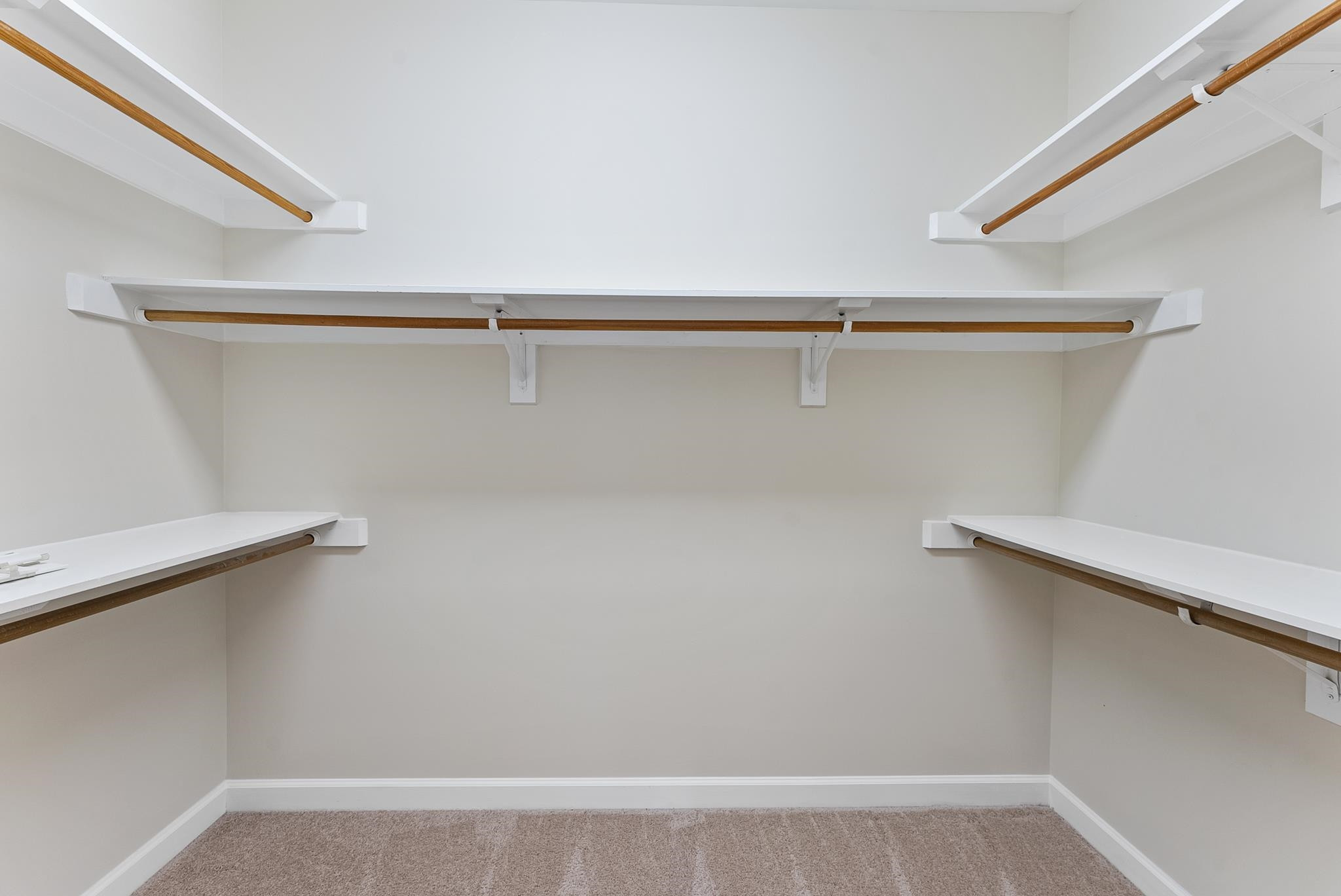 1608 Falls River Avenue Raleigh, NC 27614 - Photo 23 of 65 a view of a room with racks on the wall