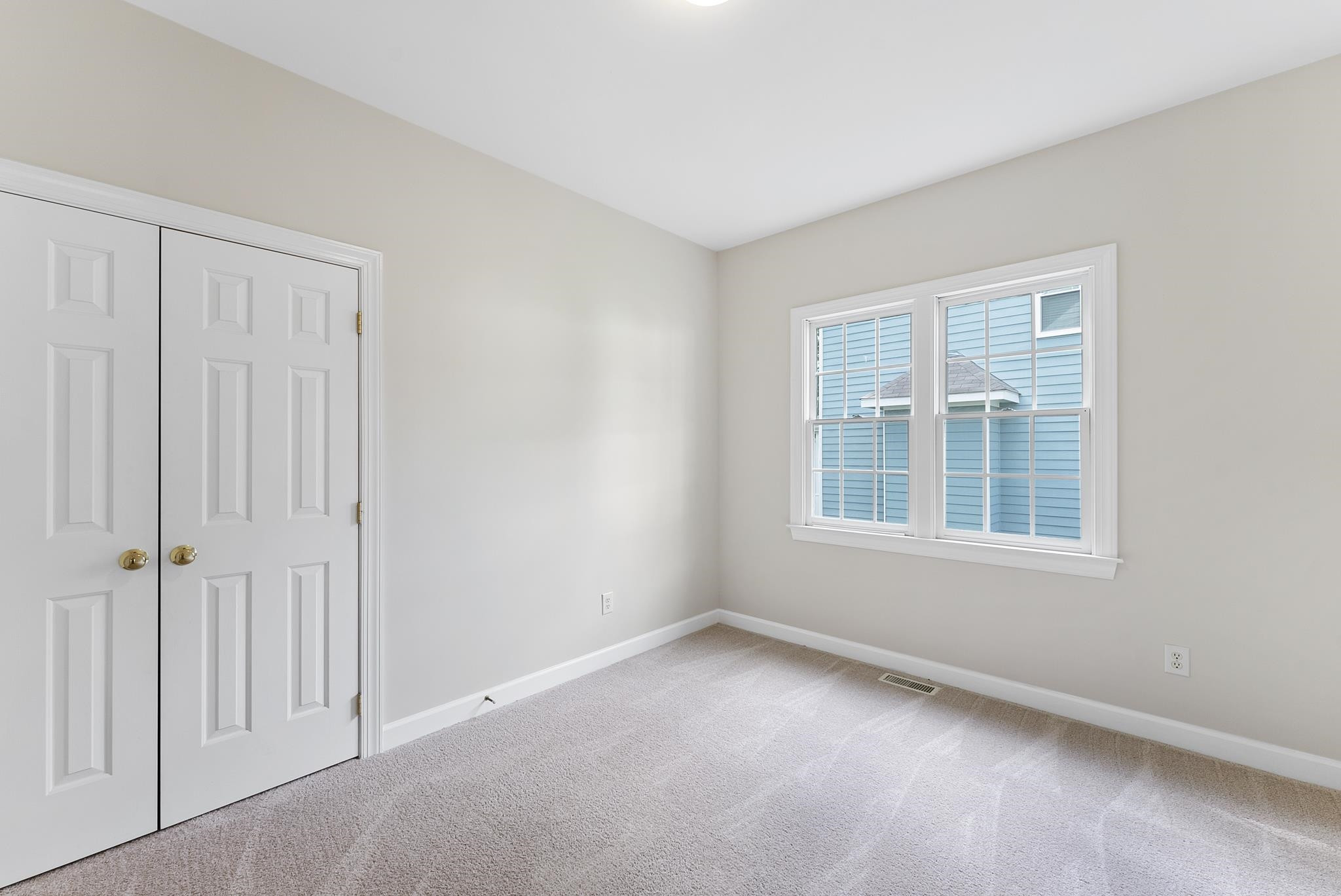 1608 Falls River Avenue Raleigh, NC 27614 - Photo 27 of 65 an empty room with a window