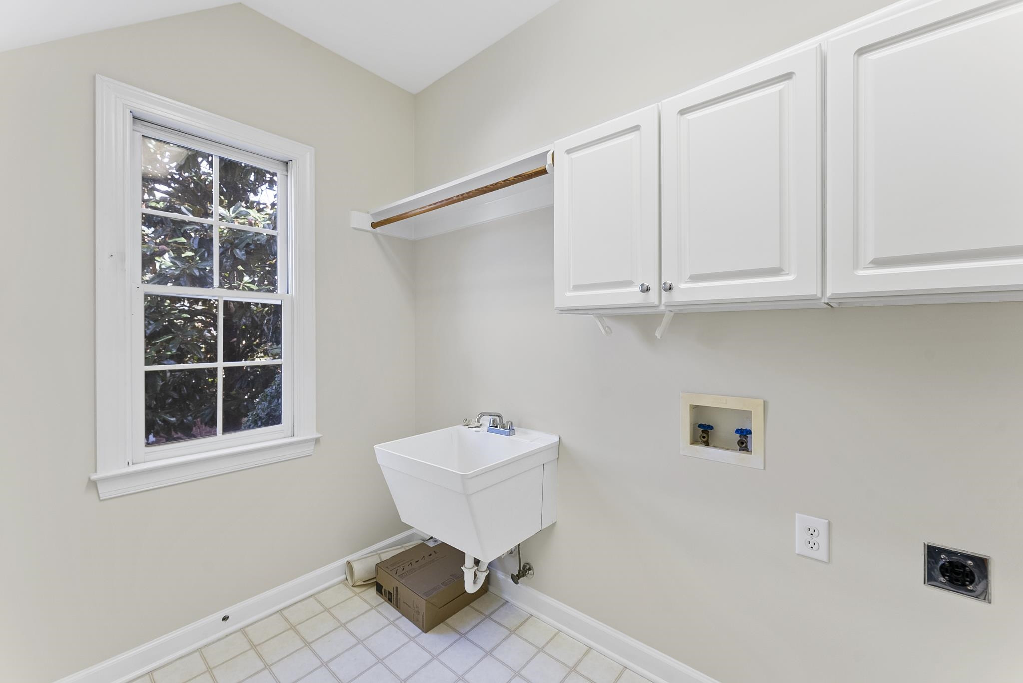 1608 Falls River Avenue Raleigh, NC 27614 - Photo 29 of 65 a bathroom with a sink toilet and a window