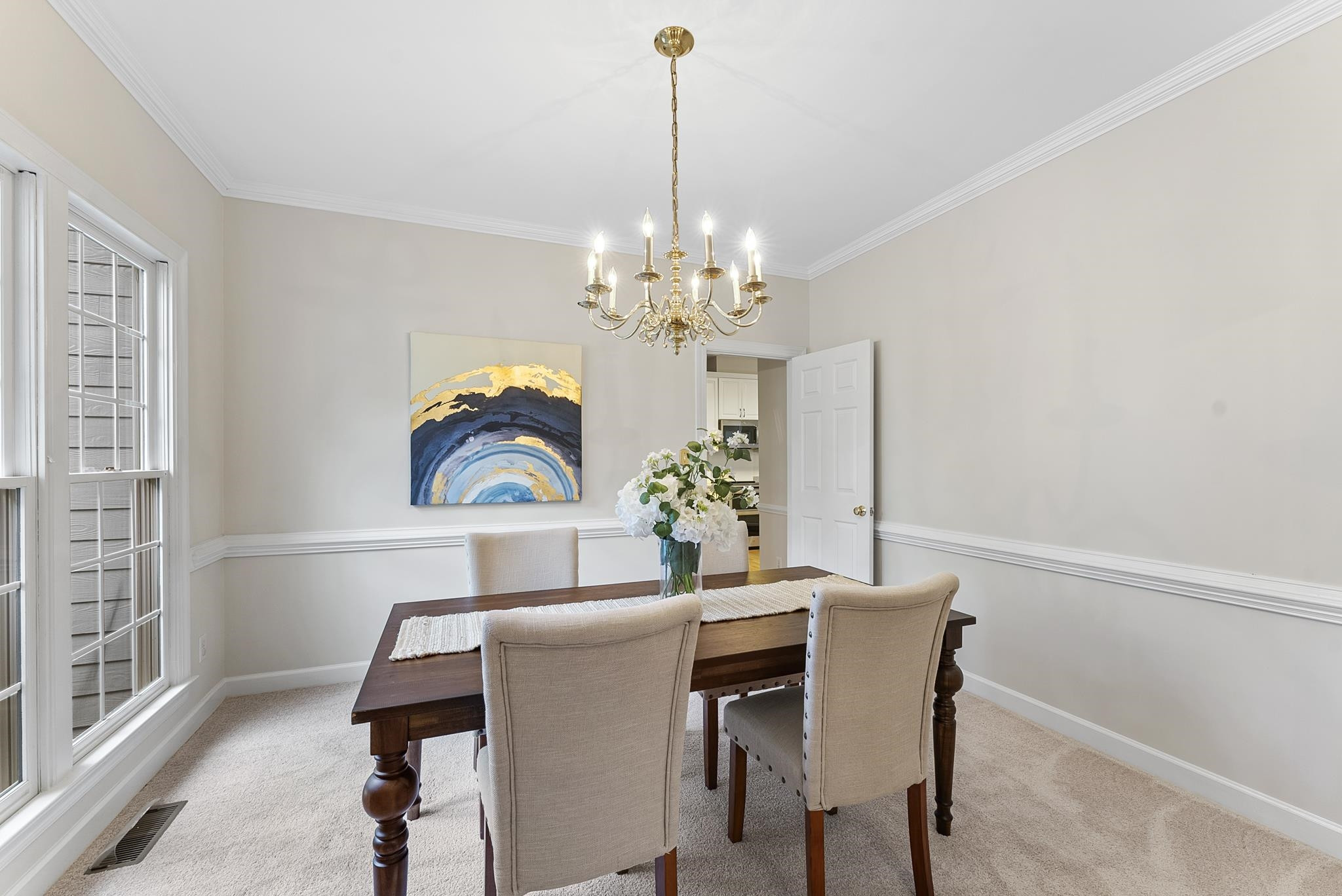 1608 Falls River Avenue Raleigh, NC 27614 - Photo 3 of 65 a dining room with furniture and chandelier