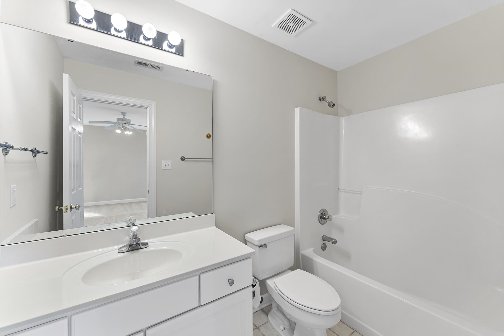 1608 Falls River Avenue Raleigh, NC 27614 - Photo 33 of 65 a bathroom with a sink toilet vanity and shower