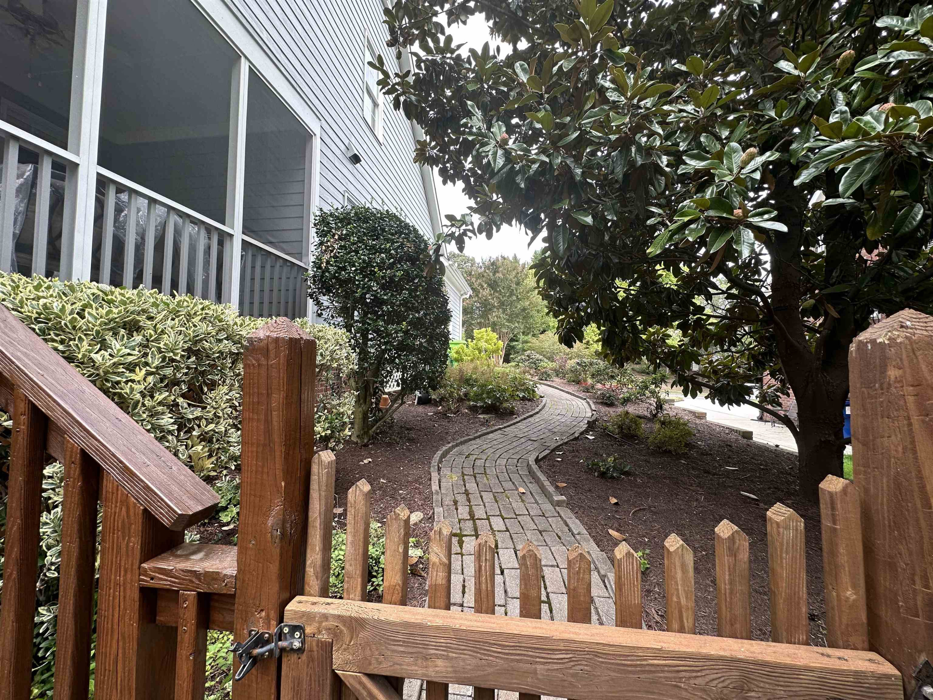 1608 Falls River Avenue Raleigh, NC 27614 - Photo 34 of 65 a view of balcony with wooden fence and potted plants