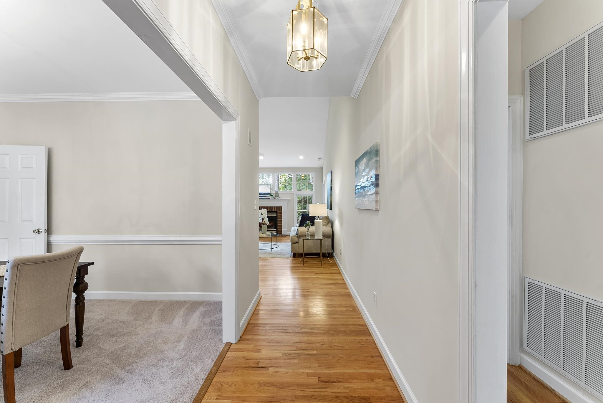 1608 Falls River Avenue Raleigh, NC 27614 - Photo 4 of 65 a view of a hallway with a furniture and entryway