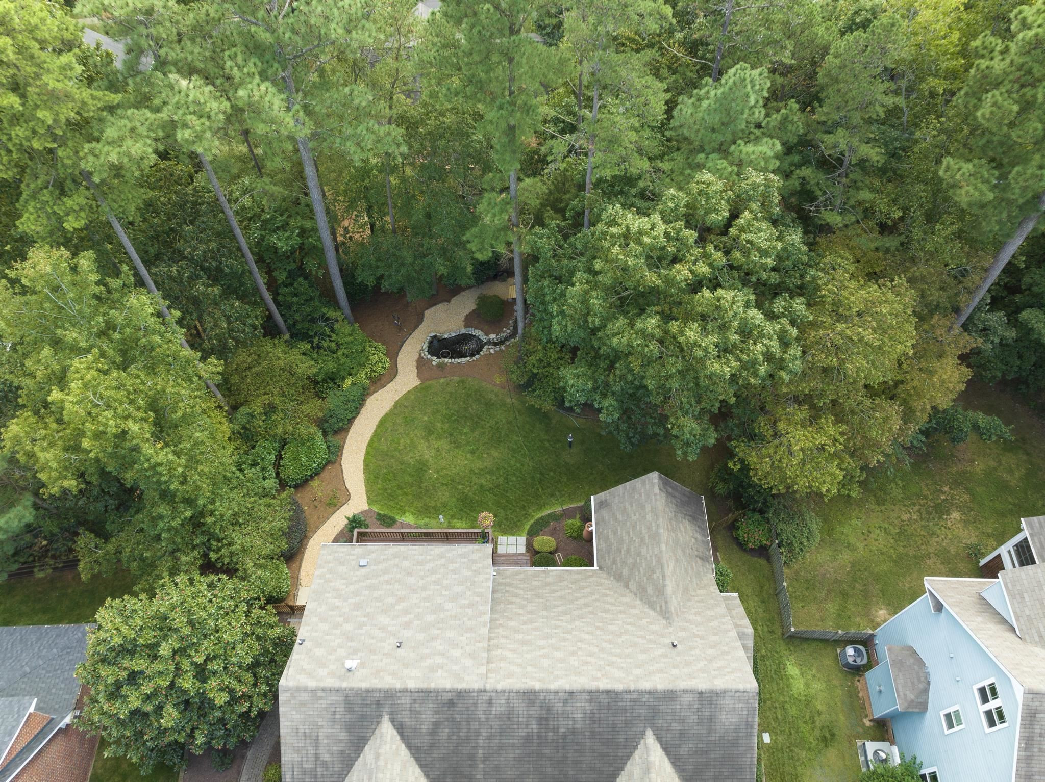 1608 Falls River Avenue Raleigh, NC 27614 - Photo 46 of 65 an aerial view of a house with outdoor space and trees all around