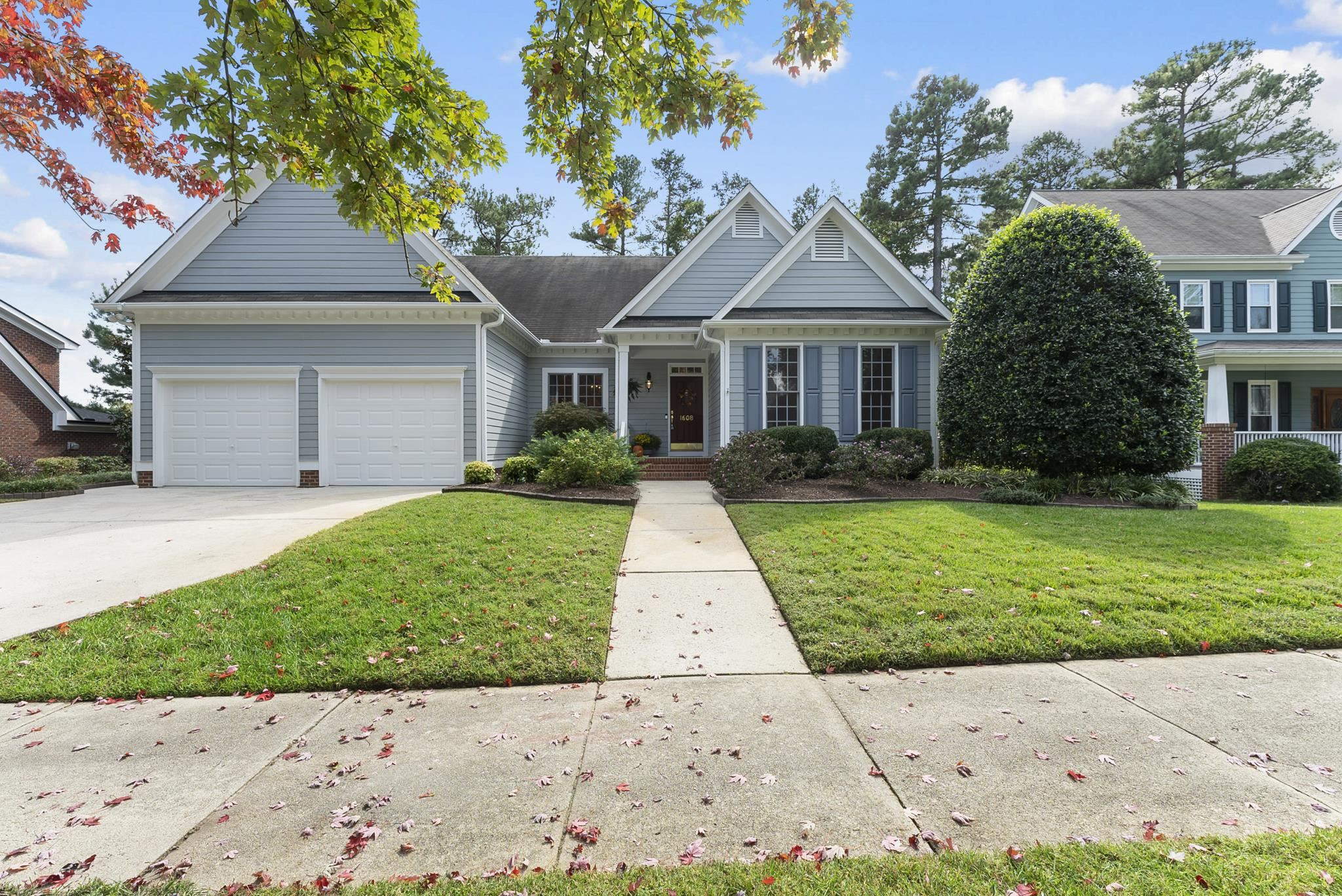 1608 Falls River Avenue Raleigh, NC 27614 - Photo 47 of 65 a front view of a house with a yard and potted plants