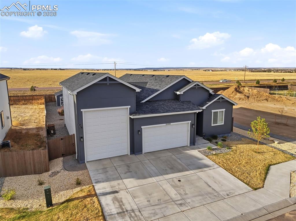 22180 Cattlemen Run Calhan, CO 80808 - Photo 49 of 50 a front view of a house with a yard