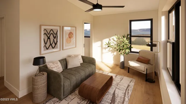 a living room with furniture and a potted plant