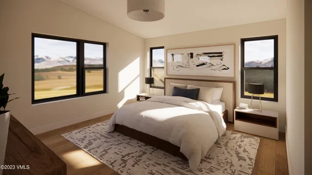 a bedroom with a large bed and a window