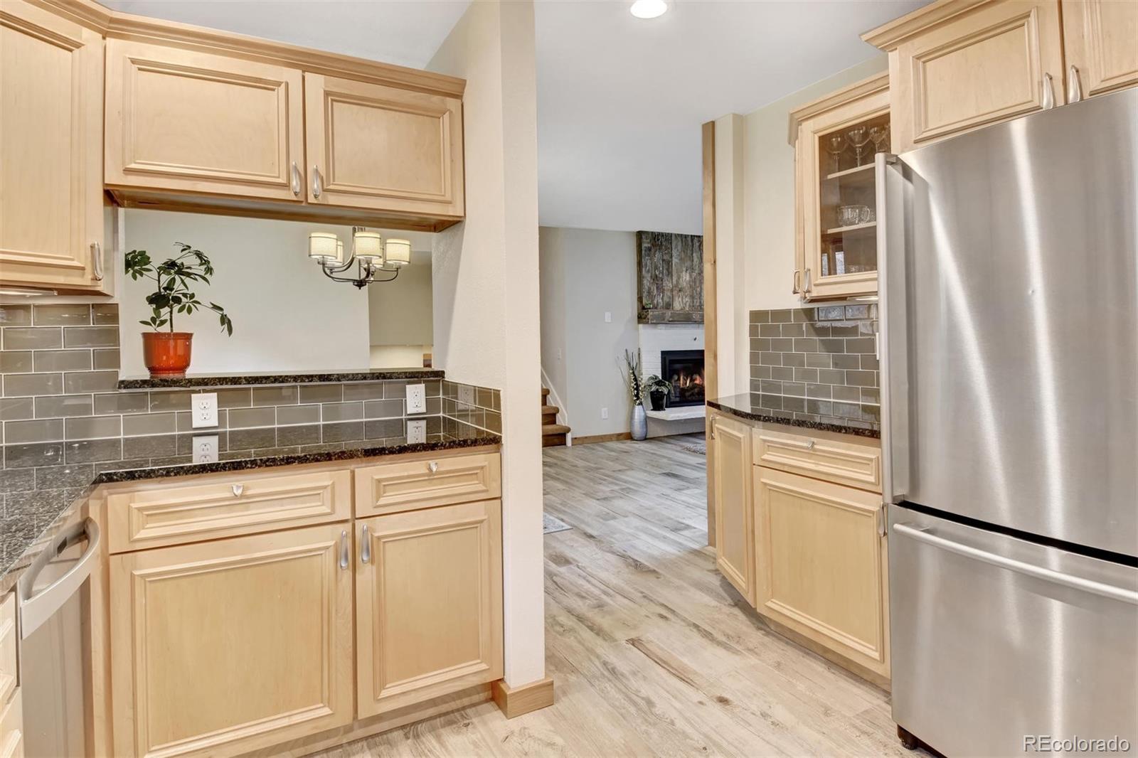 6761 Olde Stage Road Boulder, CO 80302 - Photo 13 of 36 a kitchen with stainless steel appliances a refrigerator and a cabinets