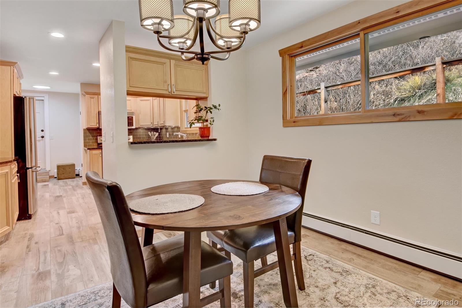 6761 Olde Stage Road Boulder, CO 80302 - Photo 15 of 36 a view of a dining room with furniture and a window