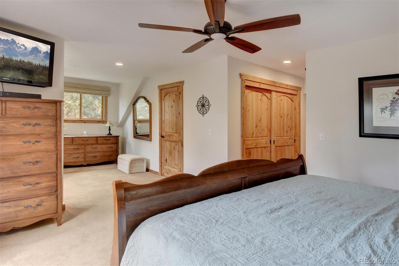 6761 Olde Stage Road Boulder, CO 80302 - Photo 18 of 36 a bedroom with a bed couch and window