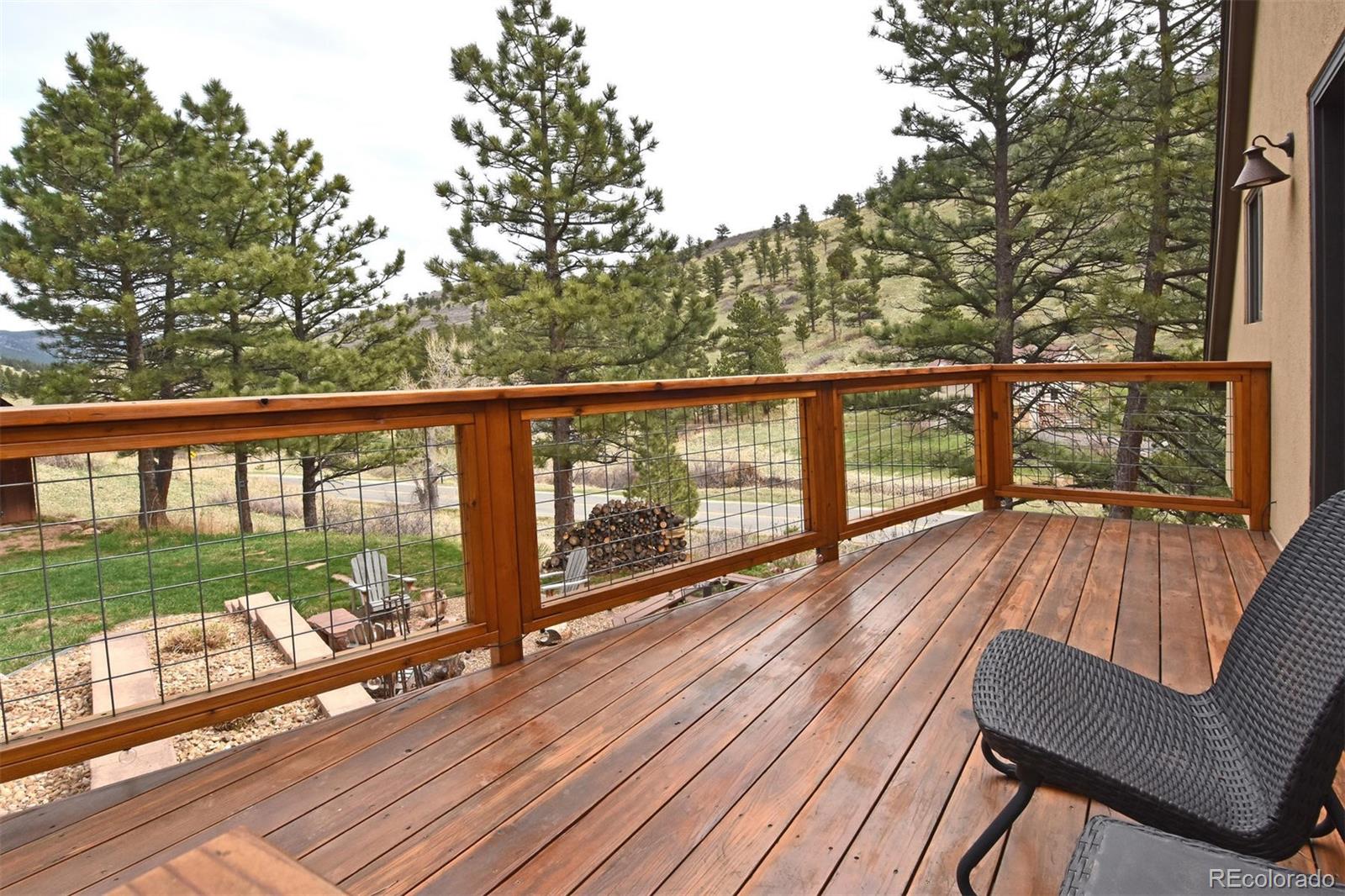 6761 Olde Stage Road Boulder, CO 80302 - Photo 19 of 36 a view of a balcony with wooden floor