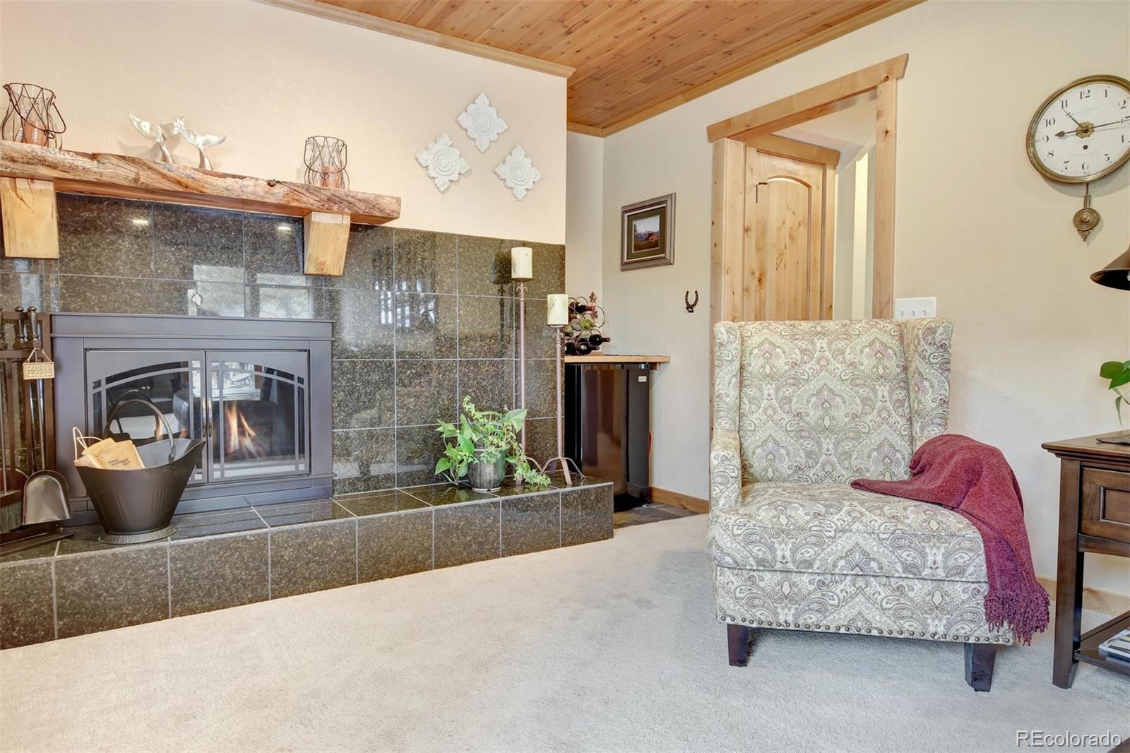 6761 Olde Stage Road Boulder, CO 80302 - Photo 25 of 36 a living room with furniture and a fireplace