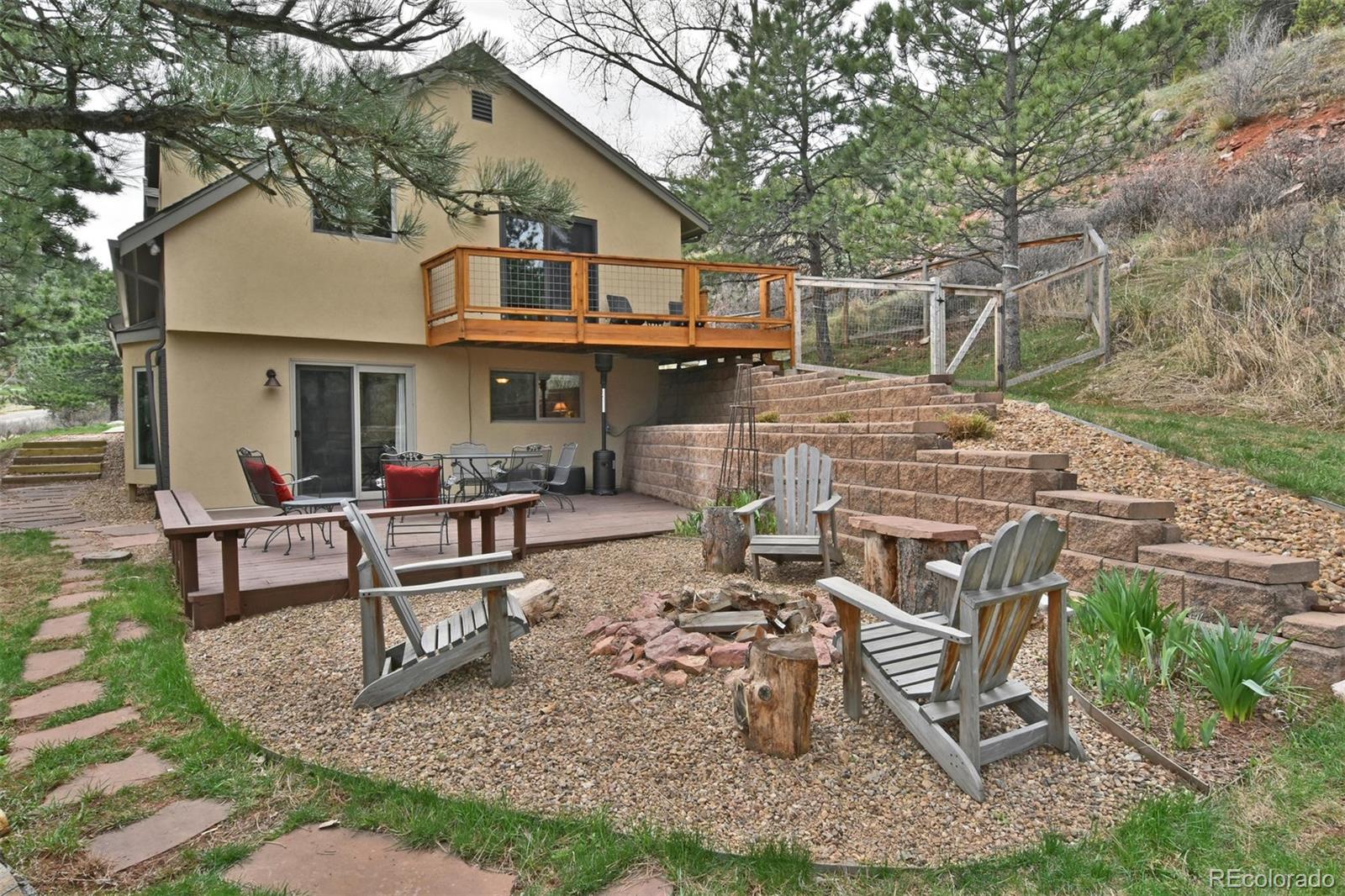 6761 Olde Stage Road Boulder, CO 80302 - Photo 3 of 36 a view of a house with patio chairs and table