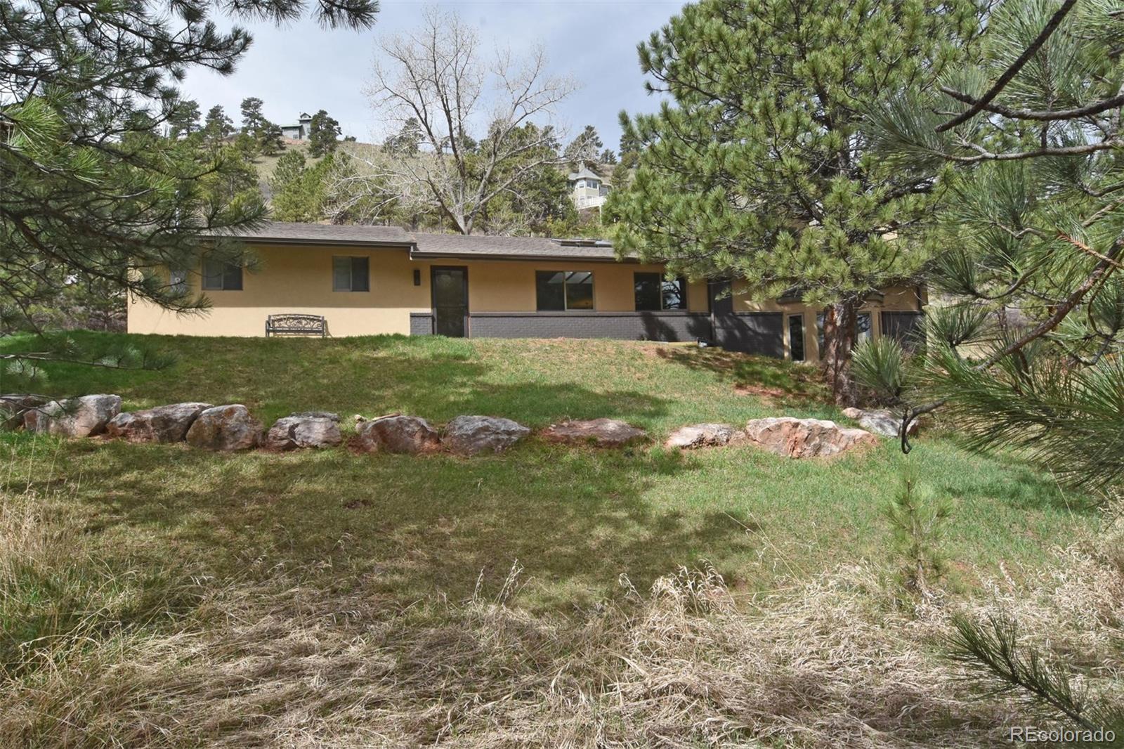 6761 Olde Stage Road Boulder, CO 80302 - Photo 4 of 36 a front view of a house with garden