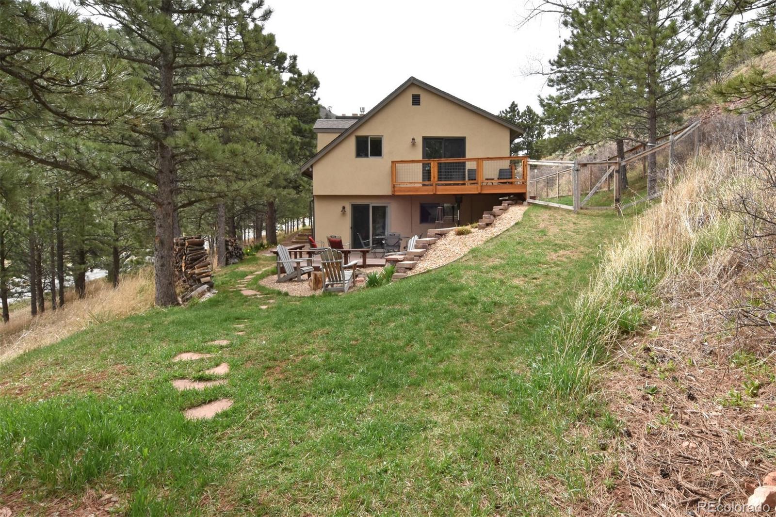 6761 Olde Stage Road Boulder, CO 80302 - Photo 5 of 36 a view of a house with a yard porch and sitting area