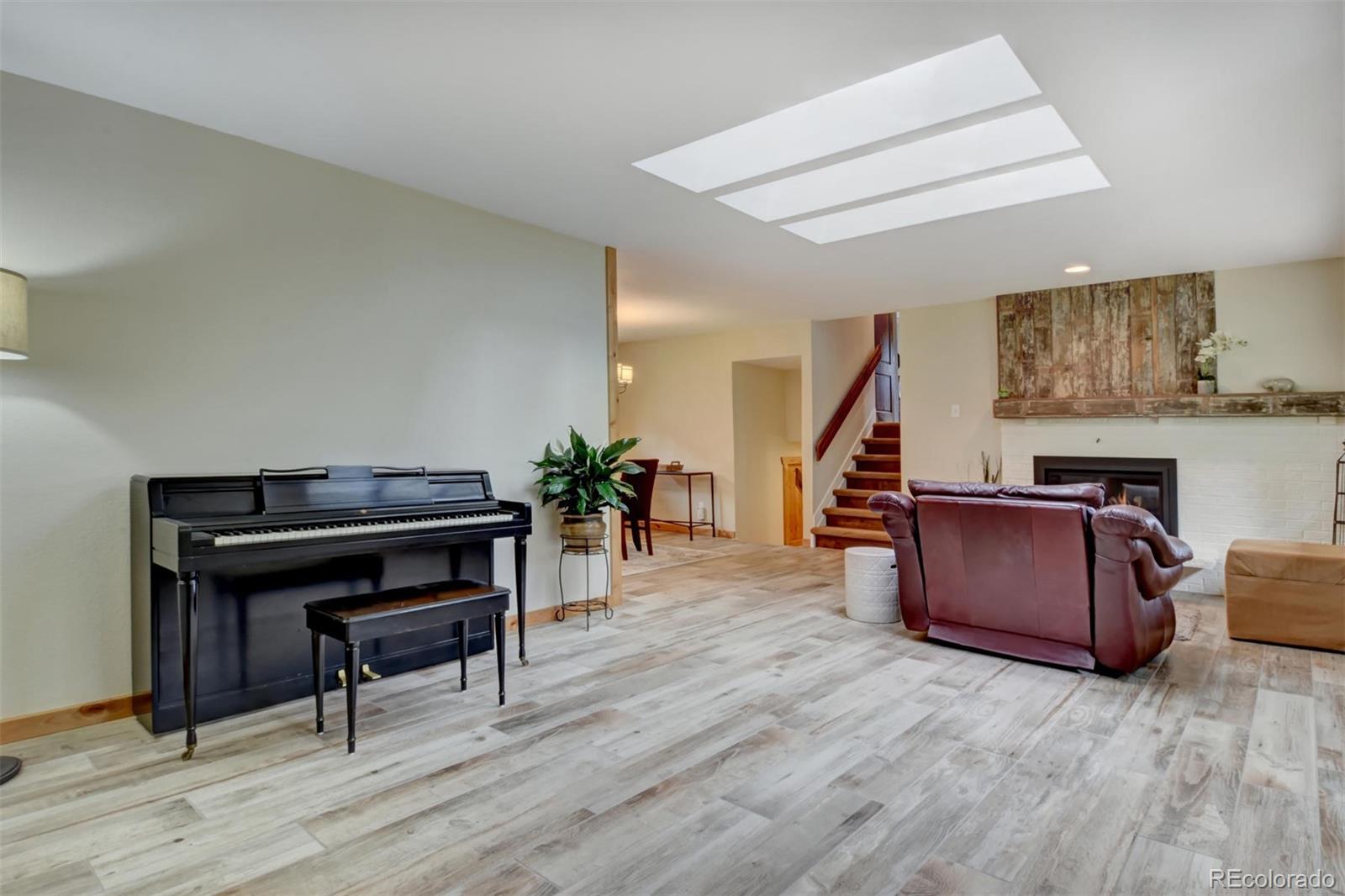 6761 Olde Stage Road Boulder, CO 80302 - Photo 6 of 36 a living room with furniture and a wooden floor