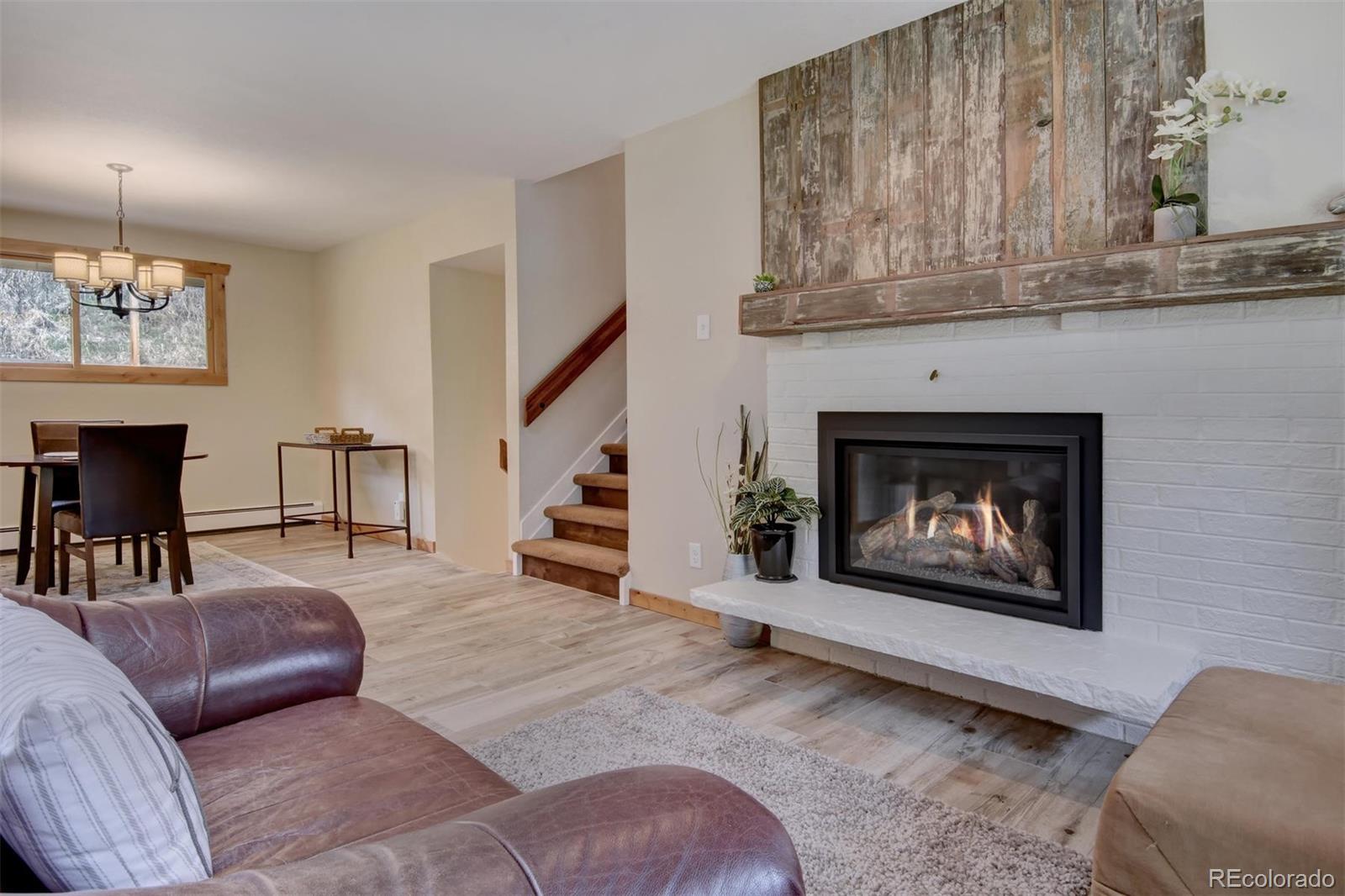 6761 Olde Stage Road Boulder, CO 80302 - Photo 7 of 36 a living room with furniture and a fireplace
