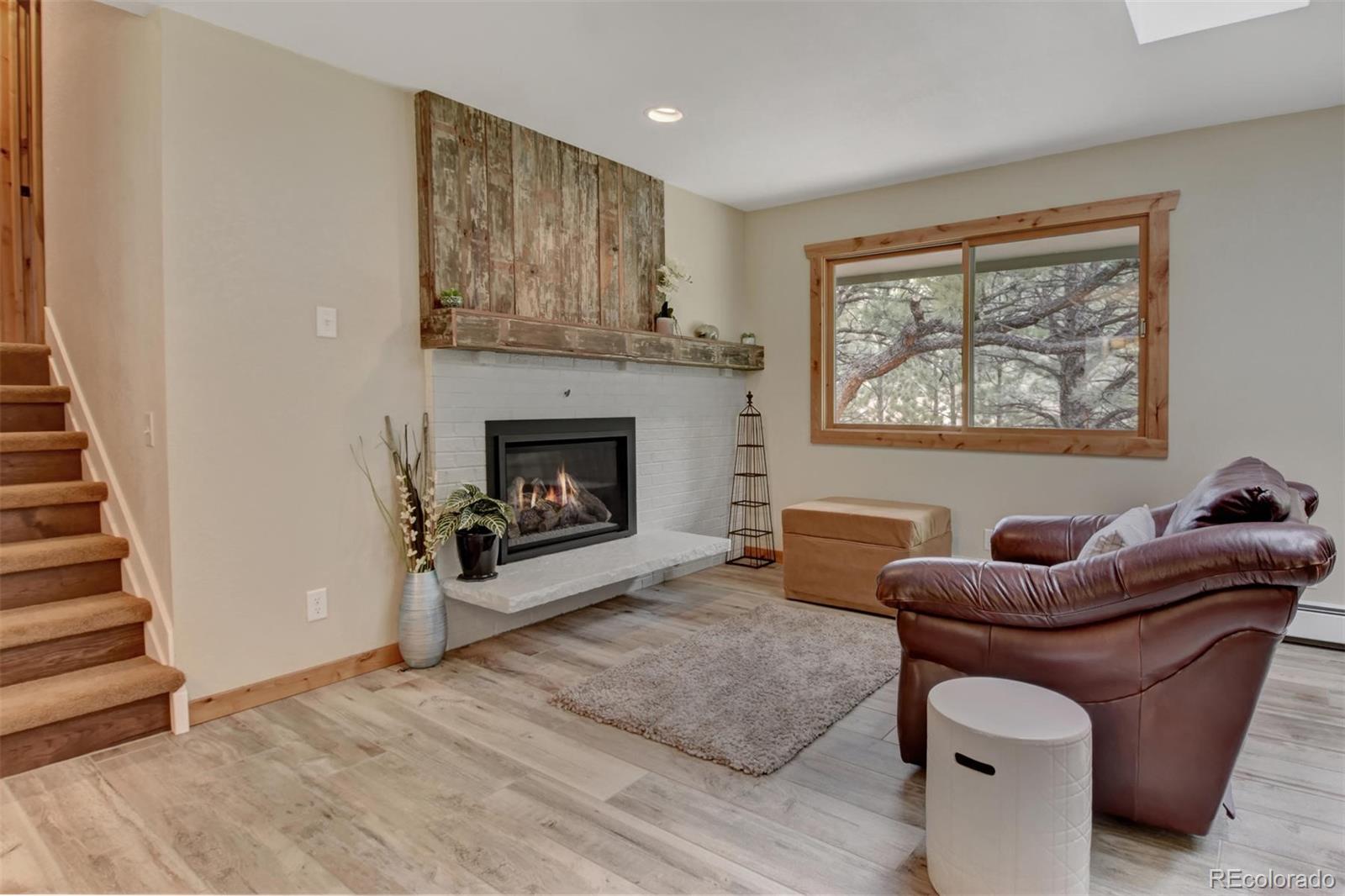 6761 Olde Stage Road Boulder, CO 80302 - Photo 8 of 36 a living room with furniture and a fireplace