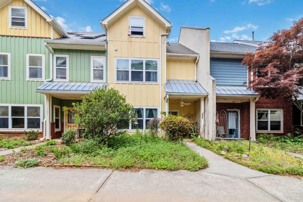 1602 Dancing Fox Road Decatur, GA 30032 - Photo 1 of 1 front view of a brick house with a yard