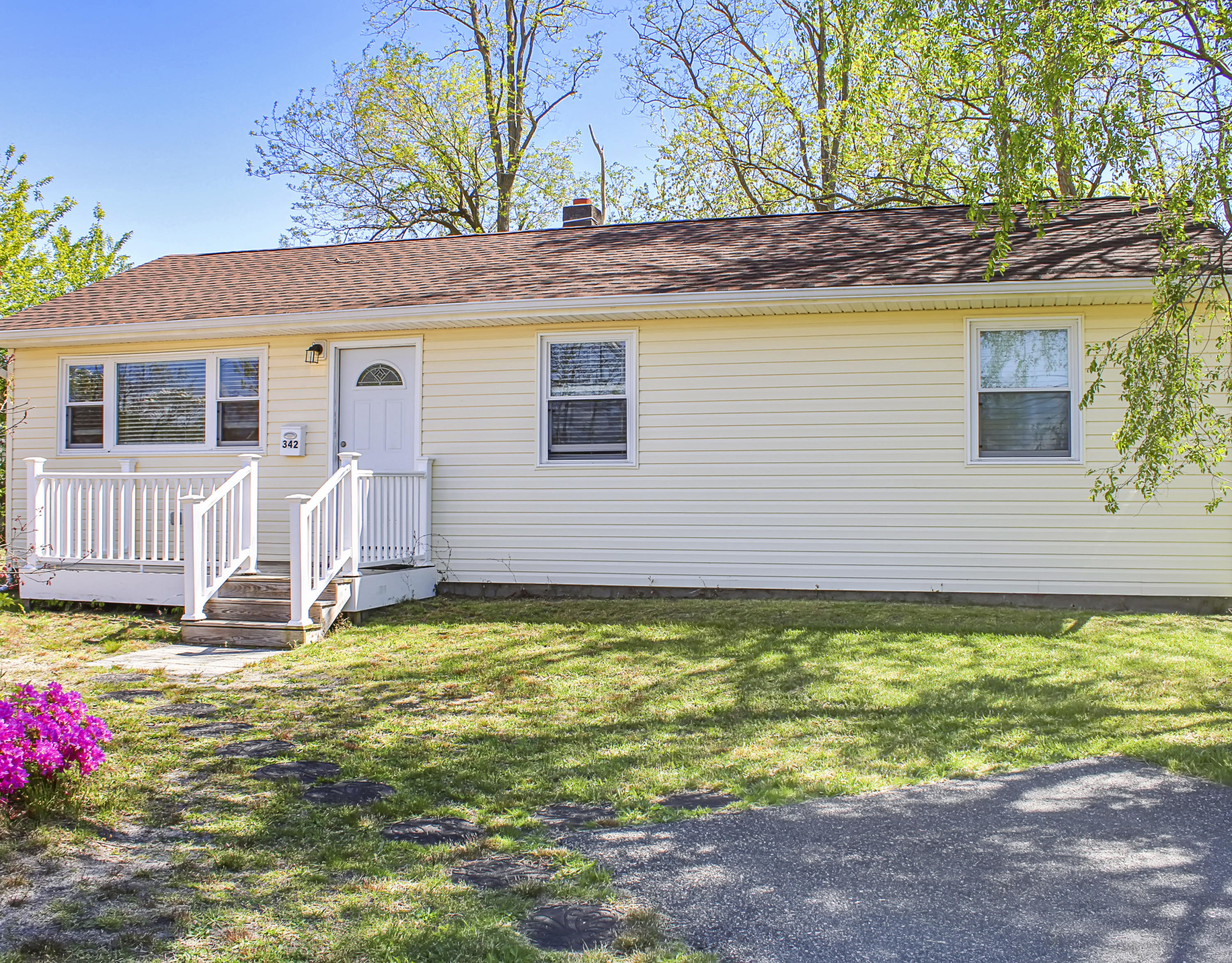 342 Stinson Road Brick, NJ 08723 - Photo 1 of 24 a view of a backyard with a garden and yard