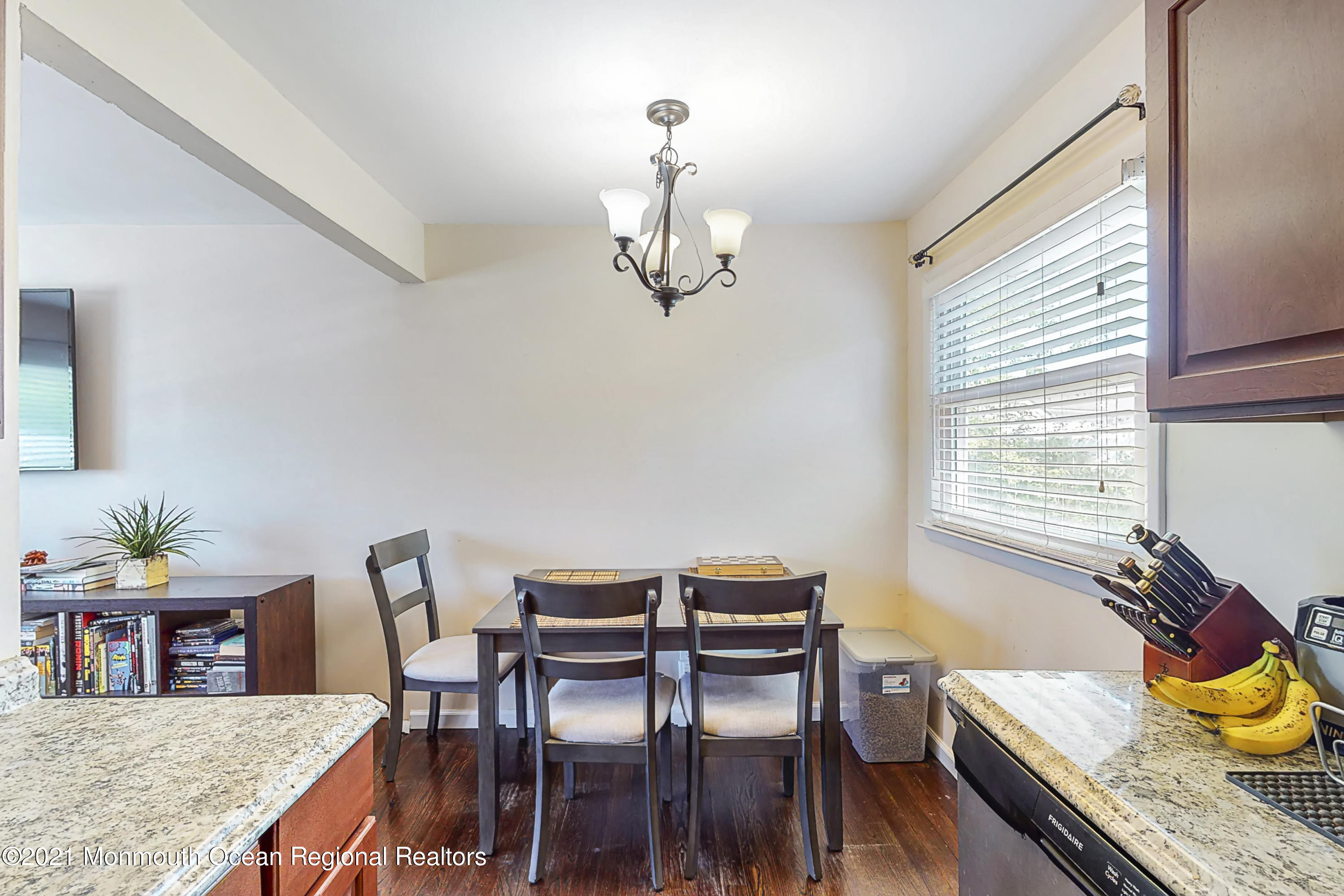 342 Stinson Road Brick, NJ 08723 - Photo 15 of 24 a view of a dining room with furniture a chandelier and wooden floor