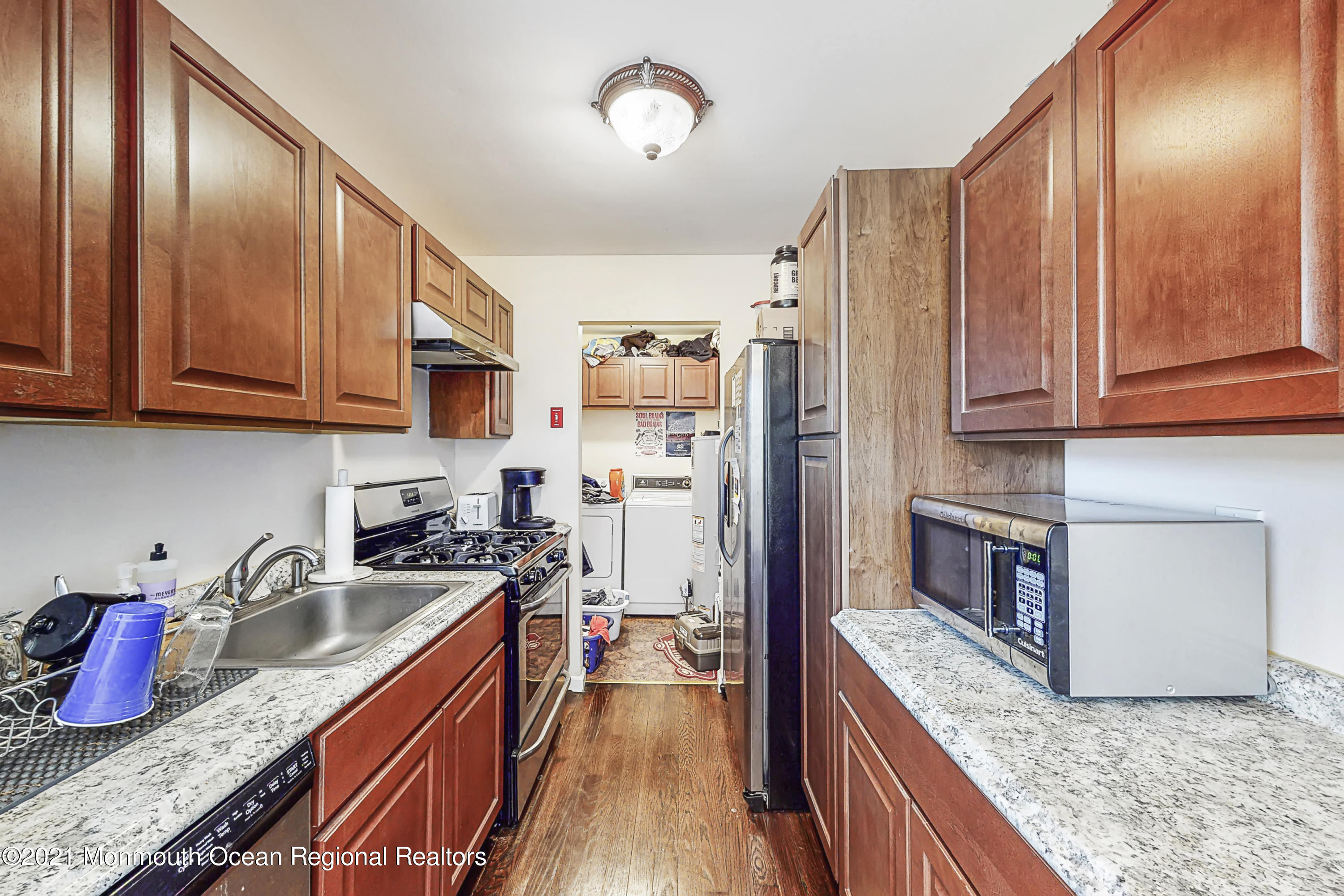 342 Stinson Road Brick, NJ 08723 - Photo 7 of 24 a kitchen with stainless steel appliances granite countertop a refrigerator a stove top oven a sink and dishwasher