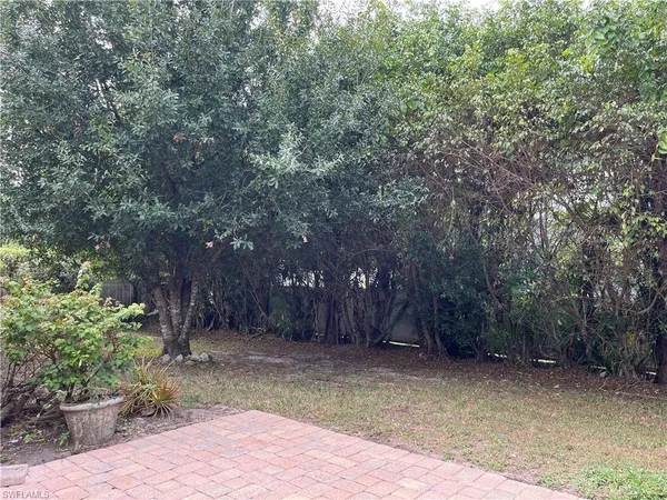 a view of backyard with green space