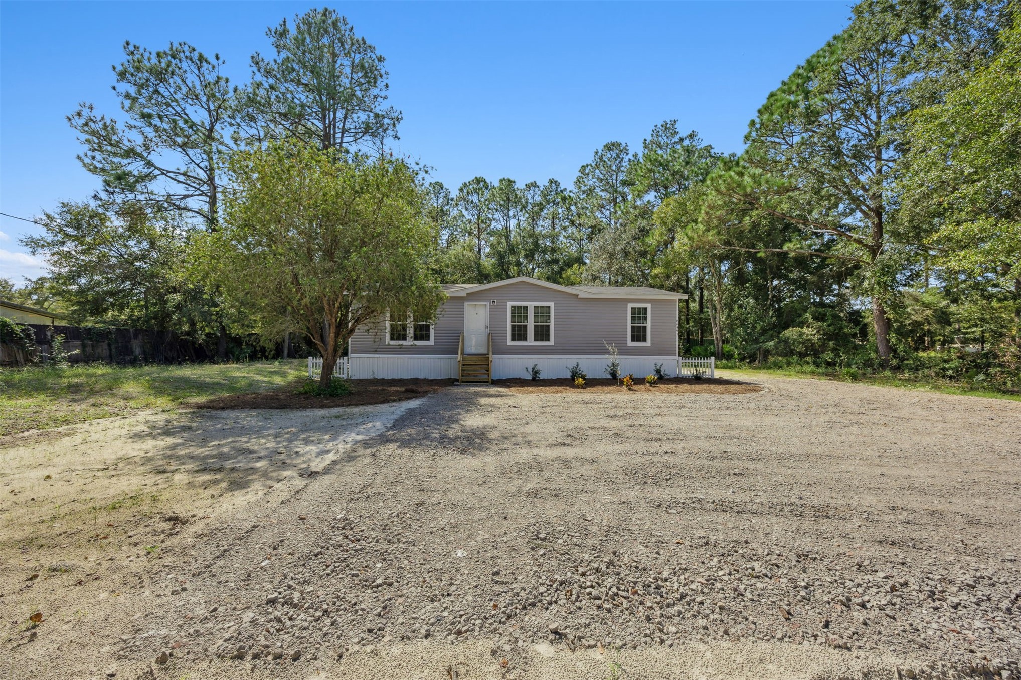 86491 Goodbread Road Yulee, FL 32097 - Photo 2 of 32 a house view with a garden space