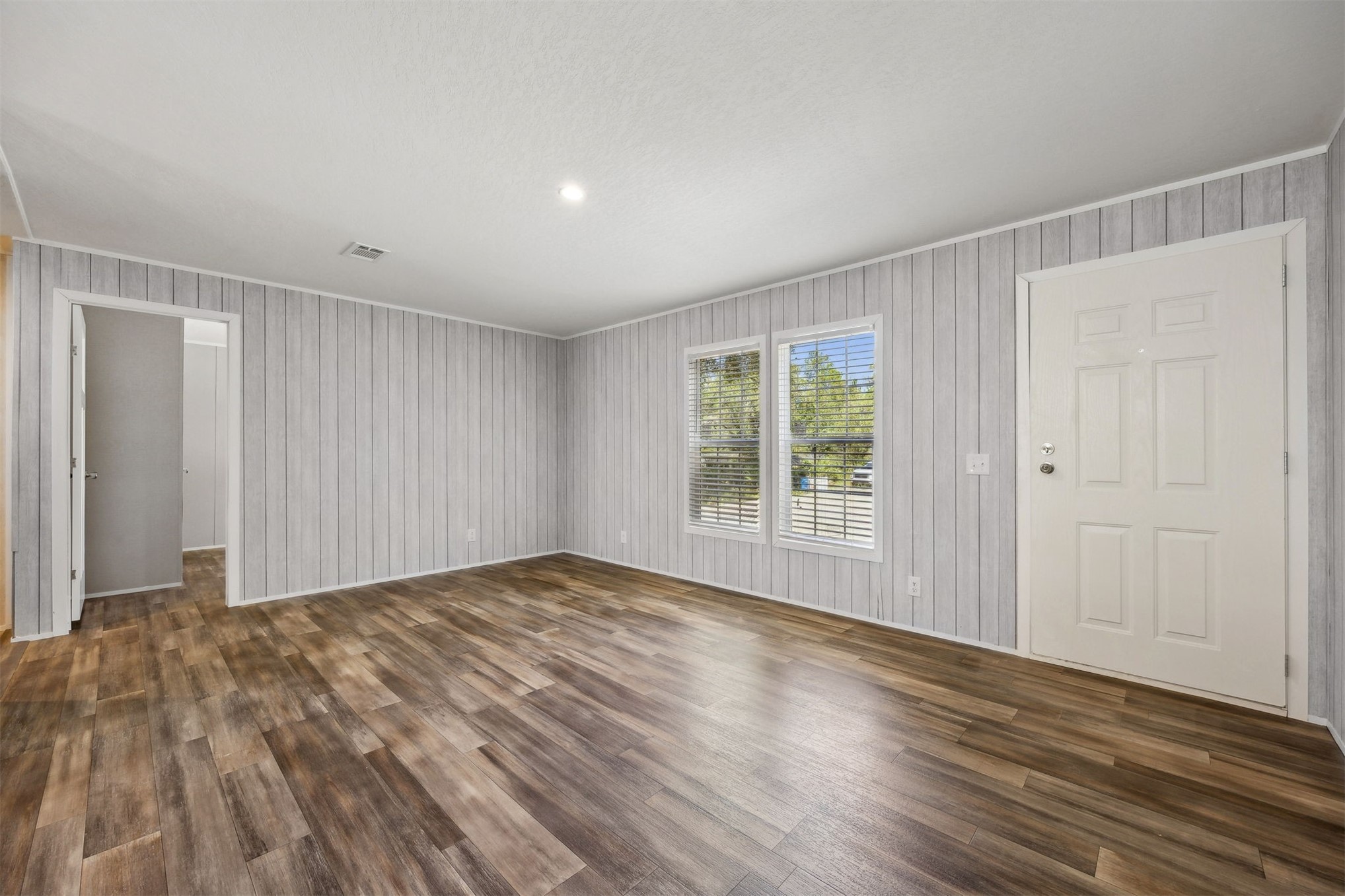 86491 Goodbread Road Yulee, FL 32097 - Photo 8 of 32 a view of a room with wooden floor and natural light