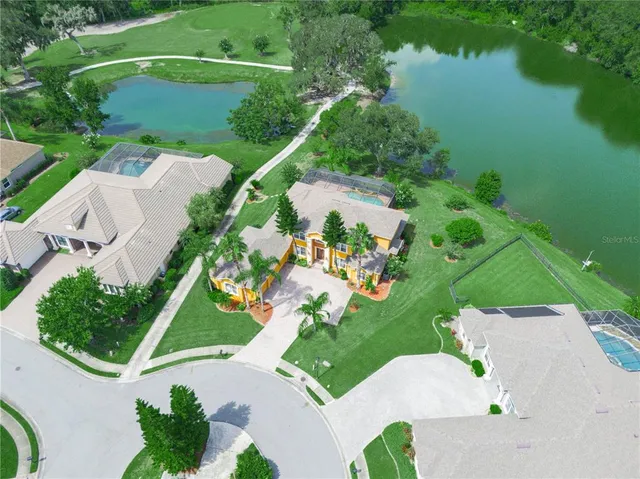 a kitchen with stainless steel appliances granite countertop a sink a refrigerator and a stove