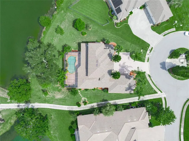 a spacious bathroom with a tub sink and mirror