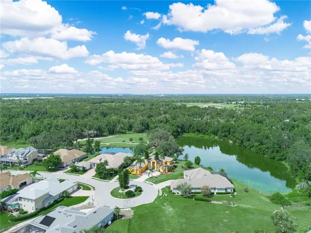 a kitchen with a refrigerator a sink and cabinets