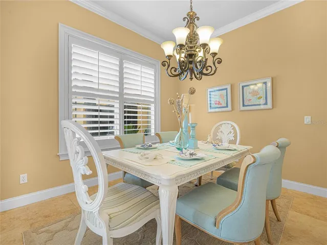 a view of a room with wooden floor and furniture