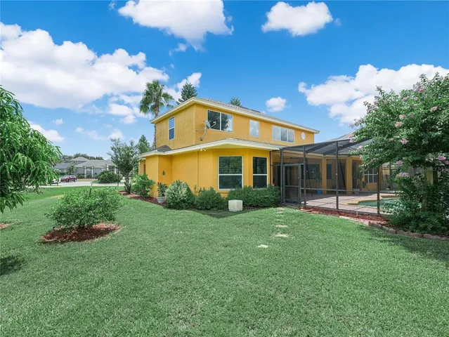 an aerial view of a house with a garden