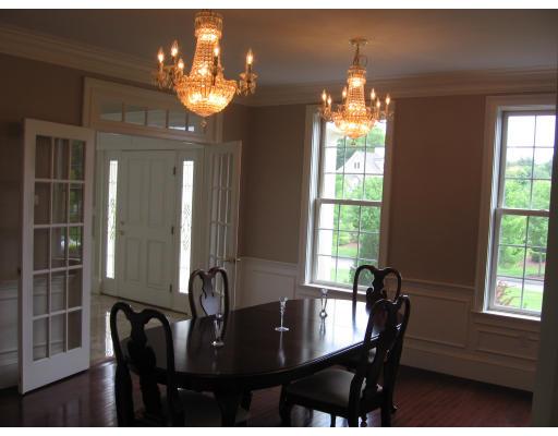7 Old Barn Road Hanover, MA 02339 - Photo 6 of 14 a view of a dining room with furniture and chandelier