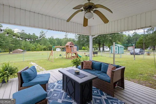 a view of a patio with couches chairs dining table and chairs