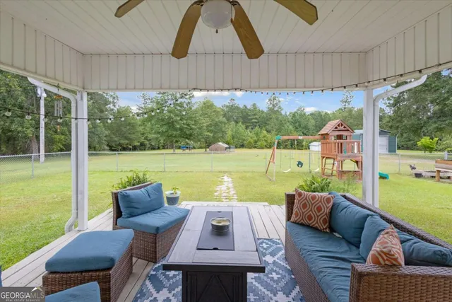 a view of a house with pool and chairs