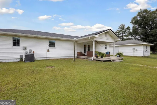 a view of a patio with table and chairs in patio